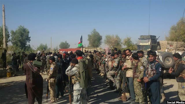 نیروهای پولیس و ارتش افغانستان پس از پاکسازی منطقه شین کلی در غرب شهرستان نادعلی