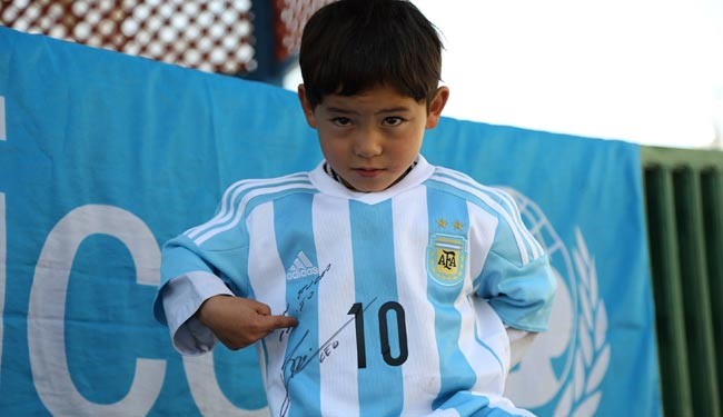 Murtaza with the signed jursey by messi
