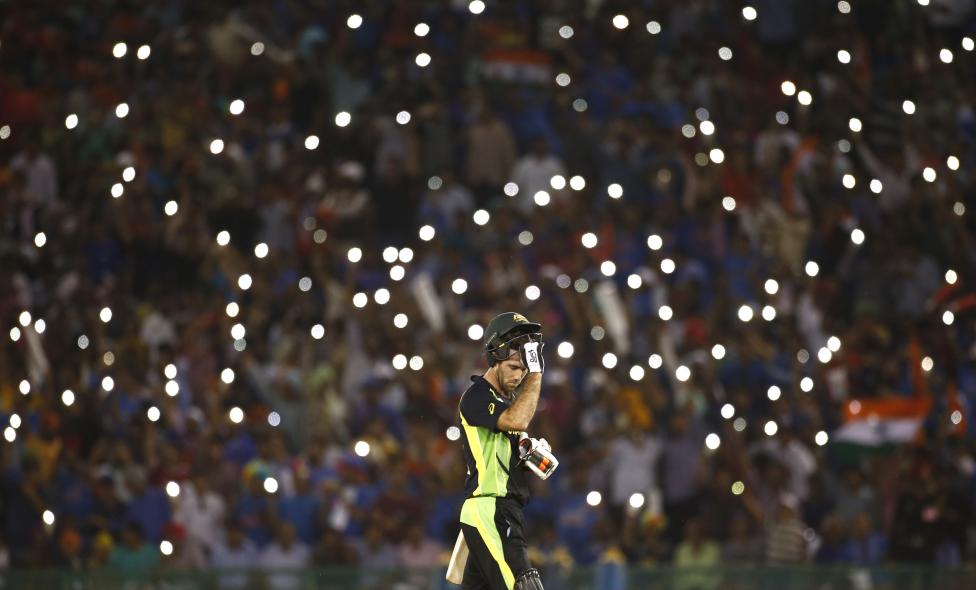 Cricket - India v Australia - World Twenty20 cricket tournament - Mohali, India - 27/03/2016. Australia's Glenn Maxwell takes his helmet off for a drink. REUTERS/Adnan Abidi