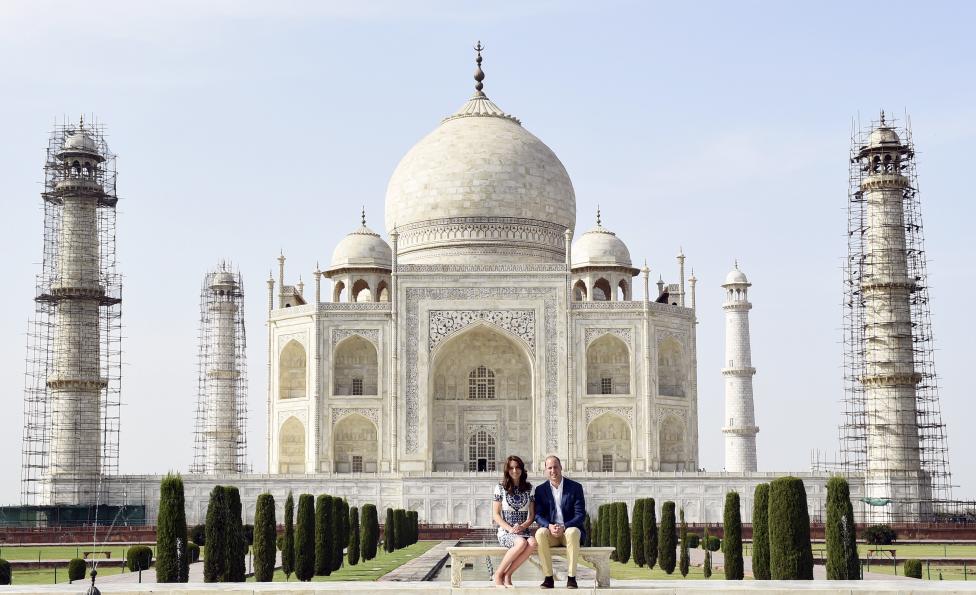 Britain's Prince William and his wife Catherine, the Duchess of Cambridge, pose as they sit in front of the Taj Mahal in Agra, April 16, 2016. REUTERS/Money Sharma/Pool