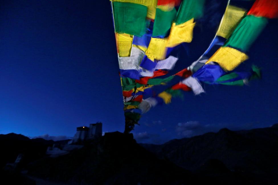 Prayer flags stretch towards Tsemo Monastery in the city of Leh, the largest town in the region of Ladakh, nestled high in the Indian Himalayas, September 26, 2016. REUTERS/Cathal McNaughton