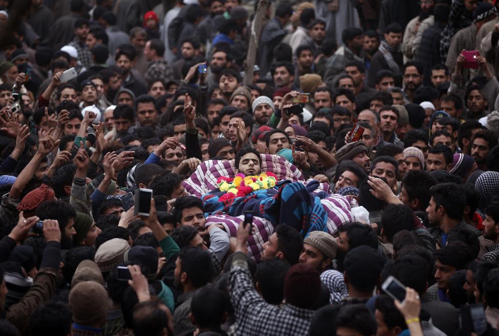 Mourners carry the body of Raqib Bashir, a suspected militant, during his funeral in Zadura village, south of Srinagar, February 7, 2016. REUTERS/Danish Ismail