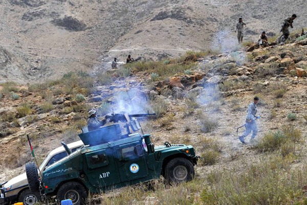 Afghan security personnel retaliate against Taliban during operation in Dur Baba district near the Pakistan-Afghanistan border in the eastern Nangarhar province on September 25, 2014.